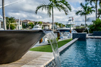 Pool Water Feature with Waterway and Boat Dock Views Photography | Jupiter, FL