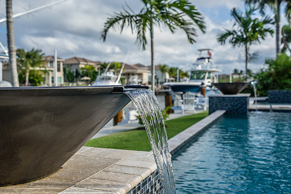 Pool Water Feature with Waterway and Boat Dock Views Photography | Jupiter, FL