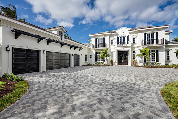 Daytime Front Exterior of White Bermuda Style Home Photography | Jupiter, FL