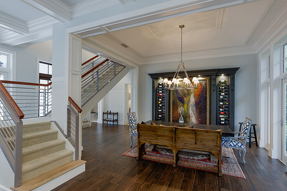 Foyer with Cable Rail Staircase and Wine Display Niche Photography | Jupiter, FL