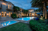 Twilight Estate Rear Exterior with Illuminated Pool Photography | Jupiter, FL
