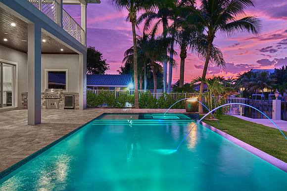 Twilight Pool with Fountain Jets and Sunset Sky Photography | Jupiter, FL