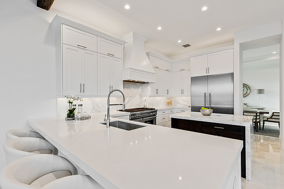 Modern White Kitchen with Waterfall Island Photography | Jupiter, FL
