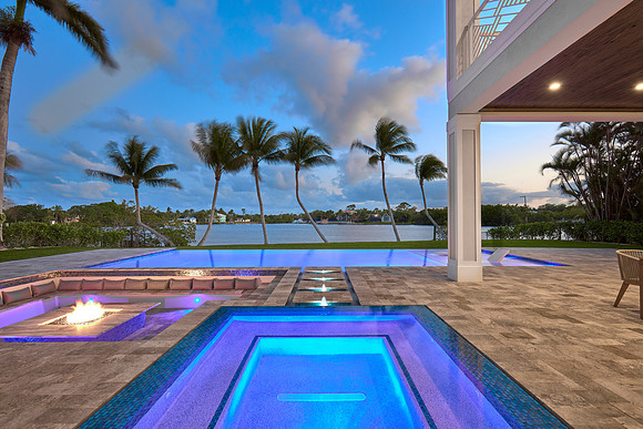 Twilight Waterfront Pool and Spa with Fire Pit Photography | Jupiter, FL