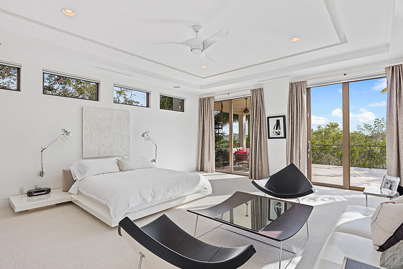 Modern Primary Bedroom with Sitting Area and Tray Ceiling Photography | Jupiter, FL
