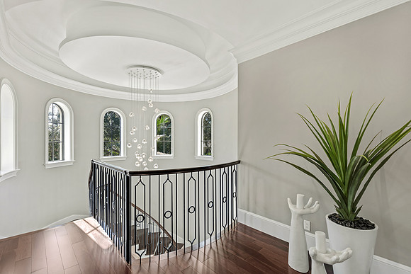 Upstairs Landing with Wrought Iron Staircase and Chandelier Photography | Jupiter, FL