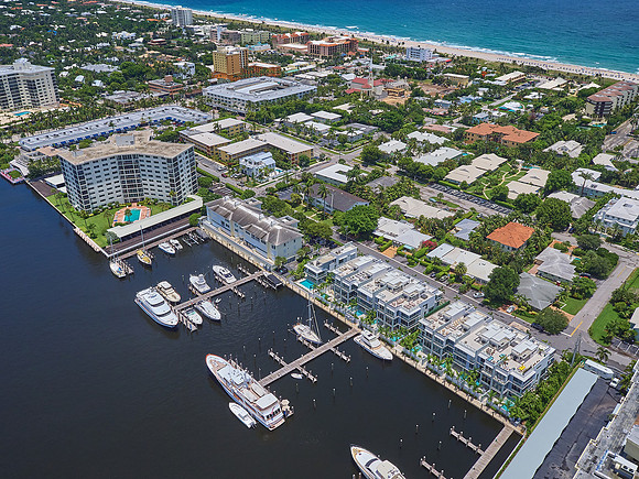 Aerial View of a Downtown Waterfront District with Marina and Beach in South Florida