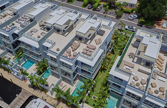 Aerial View of Modern Waterfront Townhomes with Rooftop Pools in South Florida
