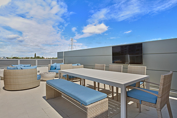 Rooftop Terrace with Outdoor Dining and Entertainment Photography | Jupiter, FL