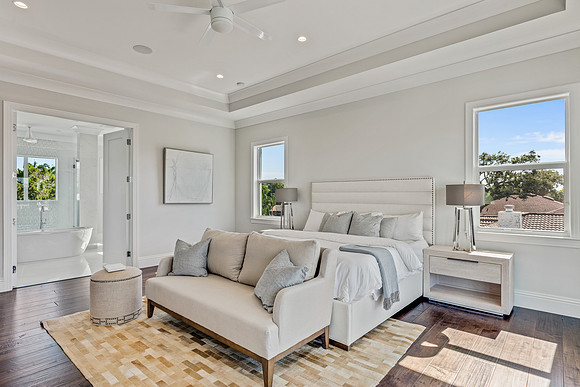 Primary Bedroom with Upholstered Headboard and Water View Photography | Jupiter, FL