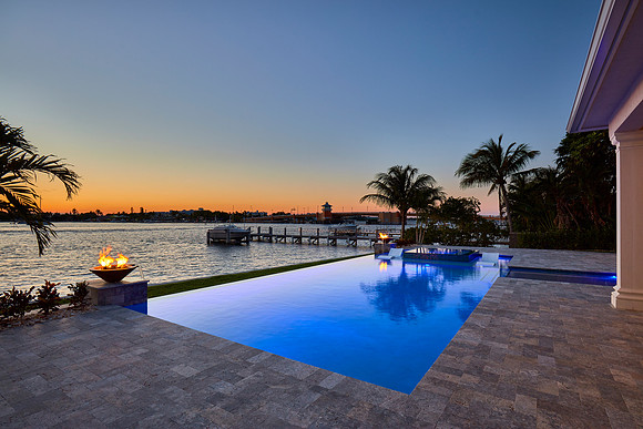 Twilight Infinity Edge Waterfront Pool with Dock View Photography | Jupiter, FL