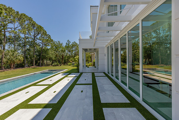 Ultra Modern Glass Home Exterior with Geometric Walkway Photography | Jupiter, FL