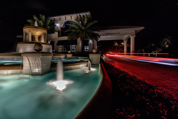 Nighttime Community Entrance with Fountain and Light Trails Photography | Jupiter, FL