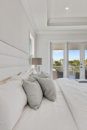 Bedroom Bedding Detail with Balcony View Photography | Jupiter, FL