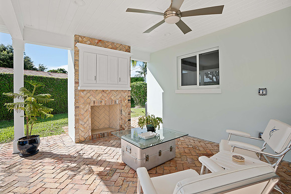 Covered Backyard Patio with Outdoor Fireplace Photography | Jupiter, FL