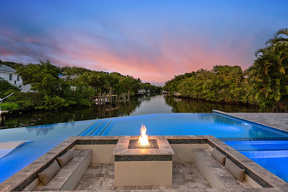 Twilight Infinity-Edge Pool Overlooking Canal Photography | Jupiter, FL