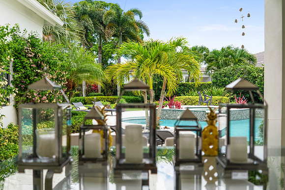Outdoor Patio Decor with Lanterns and Pool View Photography | Jupiter, FL