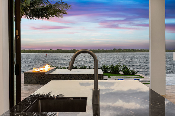 Twilight Outdoor Kitchen with Waterfront View Photography | Jupiter, FL