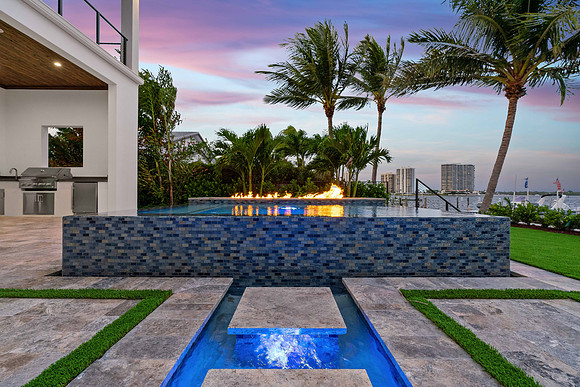 Twilight Backyard Pool and Spa with Fire Feature Photography | Jupiter, FL