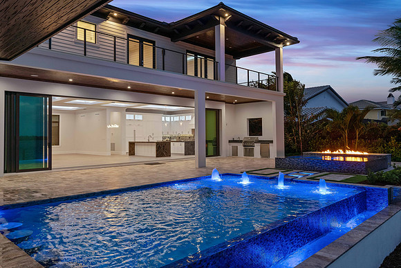 Twilight Modern Home Exterior with Covered Patio and Pool Photography | Jupiter, FL