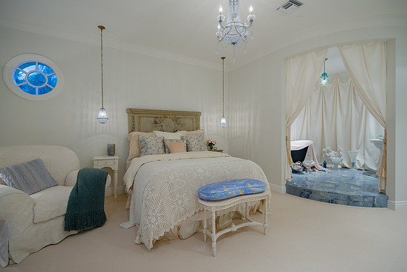 Whimsical Guest Bedroom with Canopy Bed and Round Window Photography | Jupiter, FL